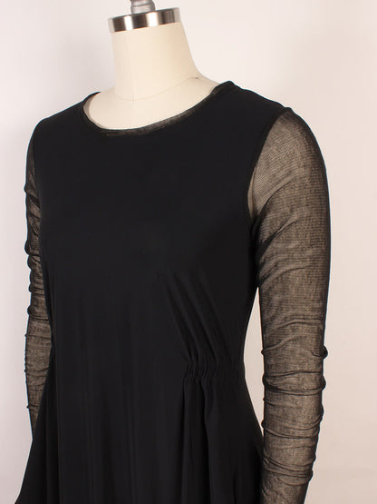 The Porto Venetian Dress in Black, displayed on a mannequin, features mesh long sleeves and gathered waist detailing. Made in Italy.