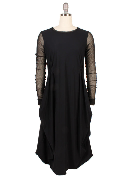 The Porto Venetian Dress in Black features mesh long sleeves, a round neckline, and draped side panels, shown on a dress form.