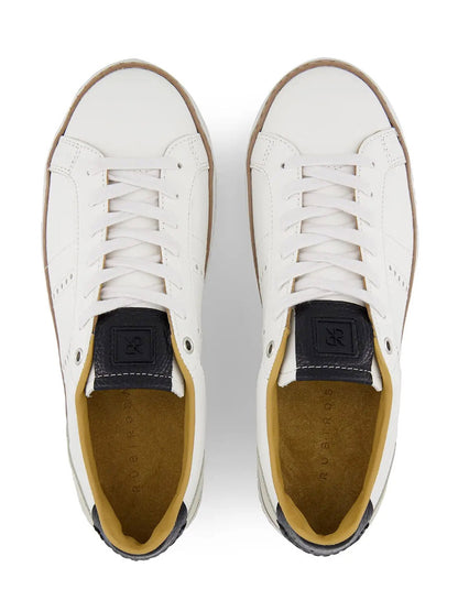 The Rubirosa AVA Sneakers in White are men's low-top leather sneakers with tan insoles, tan outsoles, and dark heel tabs, inspired by retro tennis shoes and shown from an overhead view.