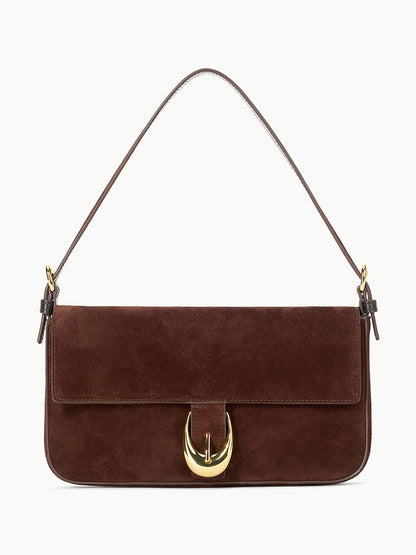 STAUD Harlow Bag in Mahogany Suede—a rectangular shoulder bag with flap closure, gold moon buckle, and slim handle.