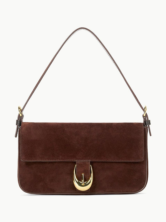 STAUD Harlow Bag in Mahogany Suede—a rectangular shoulder bag with flap closure, gold moon buckle, and slim handle.
