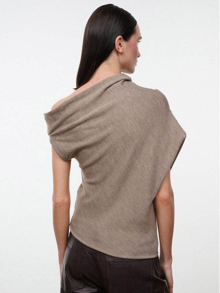 STAUD Mabel Sweater in Sesame, a light brown asymmetrical knit top with a wide, off-the-shoulder neckline.