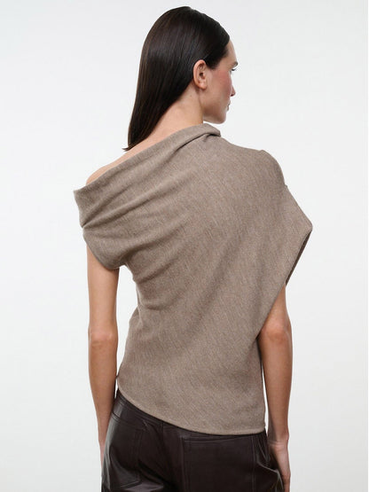 STAUD Mabel Sweater in Sesame, a light brown asymmetrical knit top with a wide, off-the-shoulder neckline.