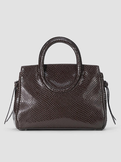 STAUD Maude Mini Carryall in Espresso Snake, a dark brown structured bag in snake-embossed leather featuring dual rounded handles and side tie details.