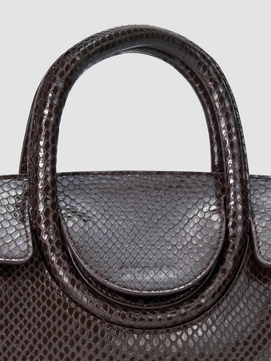 STAUD Maude Mini Carryall in Espresso Snake: a dark brown mini carryall in snake-embossed leather featuring a round top handle.