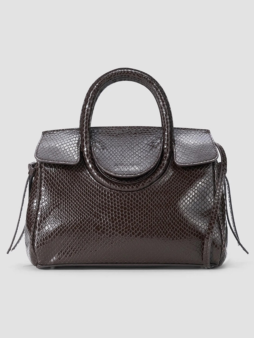 STAUD Maude Mini Carryall in Espresso Snake, a dark brown snake-embossed leather mini bag with a rounded top handle and flap closure.
