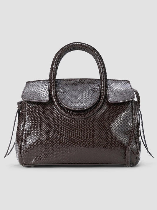 STAUD Maude Mini Carryall in Espresso Snake, a dark brown snake-embossed leather mini bag with a rounded top handle and flap closure.