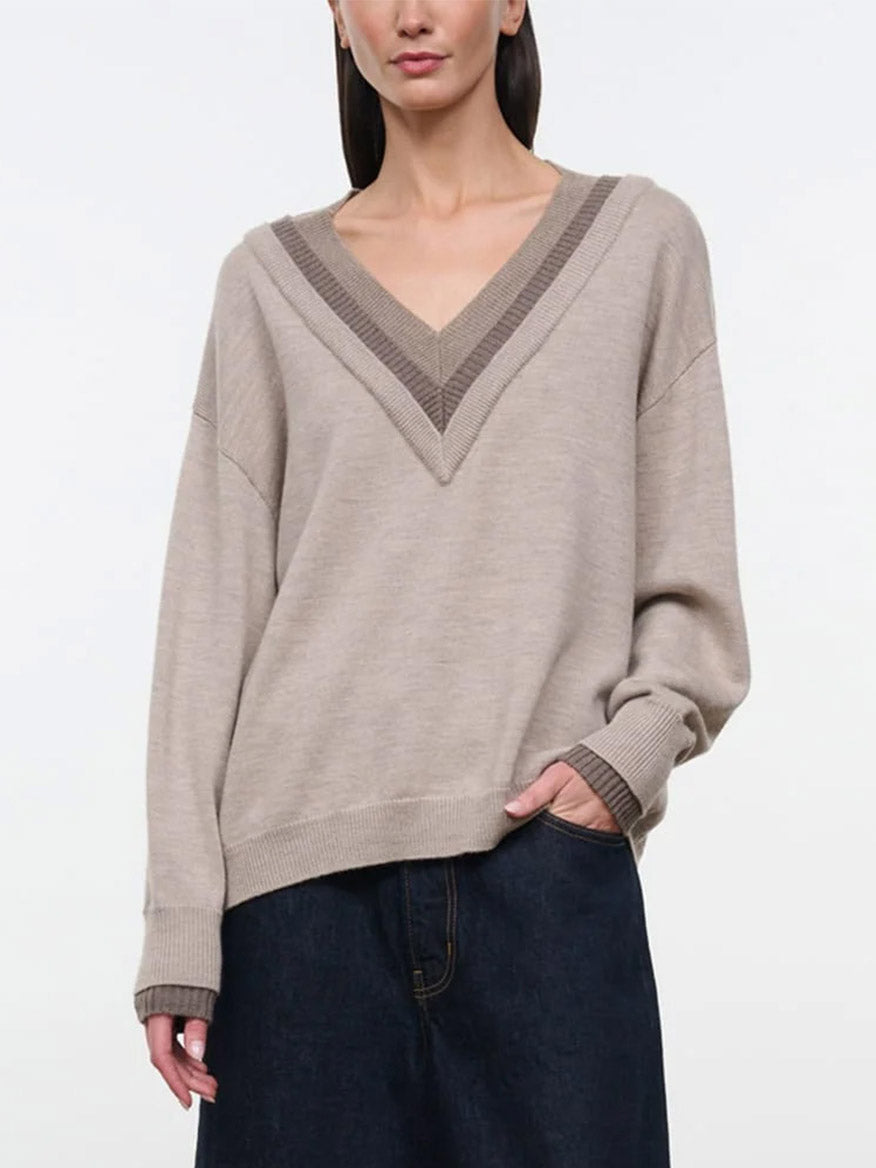 STAUD Norman Sweater in Sesame Multi: oversized, beige V-neck sweater featuring a triple-layer neckline and contrast dark brown ribbed cuffs.