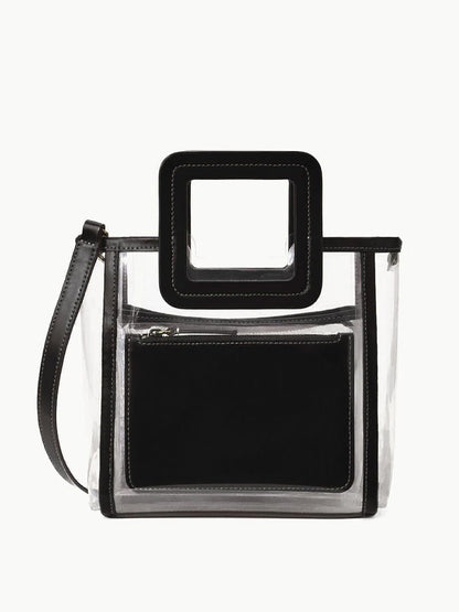 STAUD Stadium Mini Shirley Bag in Clear/Black: A stadium-approved clear PVC bag with black trim, square handle, detachable shoulder strap, and inner black zip pouch—stylish and practical for events.