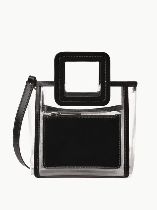 STAUD Stadium Mini Shirley Bag in Clear/Black: A stadium-approved clear PVC bag with black trim, square handle, detachable shoulder strap, and inner black zip pouch—stylish and practical for events.