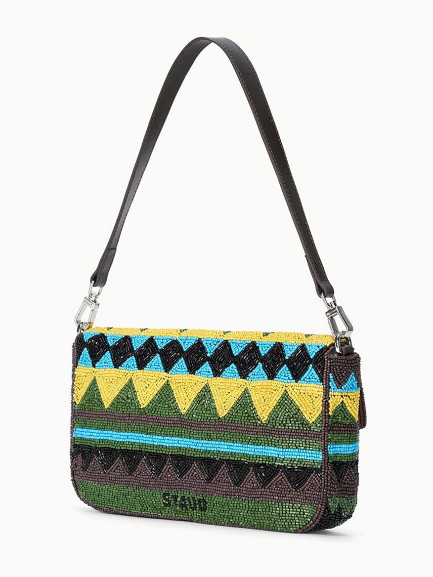 The STAUD Timmy Shoulder Bag in Happy Sack features a beaded geometric pattern in yellow, green, blue, and black, with a black strap, silver hardware, and an interior zip pocket for added functionality.