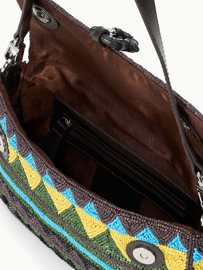 The STAUD Timmy Shoulder Bag in Happy Sack features an open beaded design, a brown satin lining, an interior zip pocket, and magnetic snap closures on the flap.