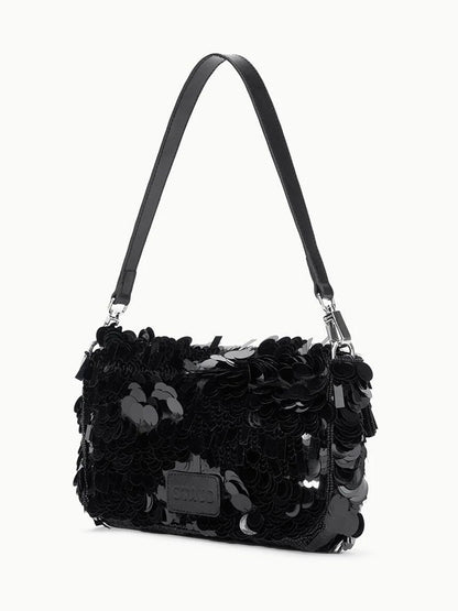 The STAUD Timmy Shoulder Bag in Black features a sleek design with a leather strap and a body embellished with large, shiny black sequins.