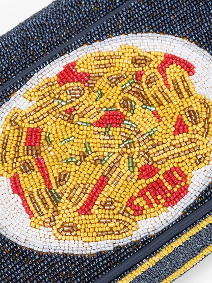 Close-up of the STAUD Tommy Beaded Bag in Staudelloni, featuring a hand-beaded design of a pasta plate with red and green toppings, shown against a white background.