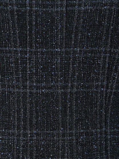 Close-up of the STAUD Wells Midi Sleeveless Dress in Ink Blue Plaid, featuring a dark blue checkered pattern with a subtle shimmering texture.
