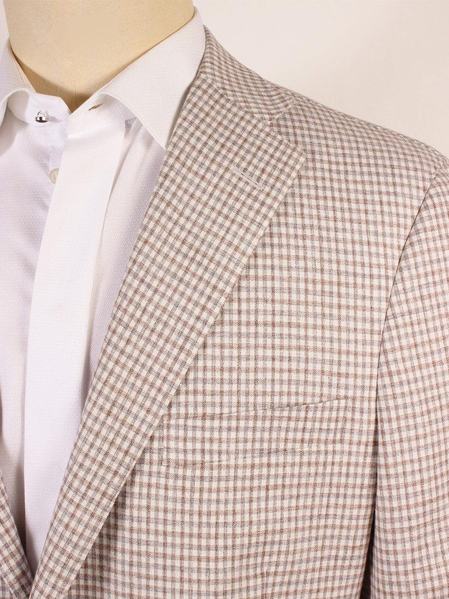 A close up of a Samuelsohn Super Light Sport Jacket in Cream/Brown/Grey Check, woven in Italy, made from a cotton/linen blend fabric.