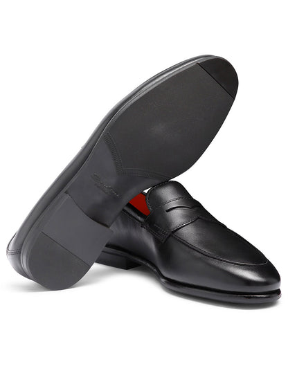 Santoni Carlos Black Leather Penny Loafer, made in Italy, shown with one shoe upright and the other highlighting the sole.