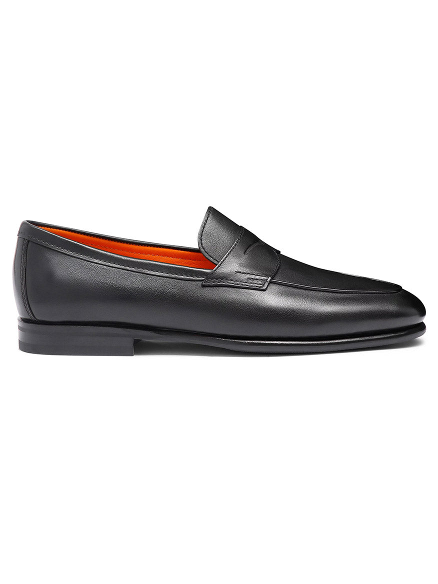 The Santoni Carlos Black Leather Penny Loafer is a premium Italian-made shoe with black leather, a low heel, orange inner lining, and a classic penny slot detail.