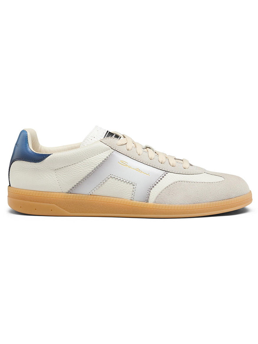 The Santoni Double Buckle Sneaker in White/Blue is a low-top men's leather shoe from the DBS Olympic Sneaker collection, inspired by retro tennis styles with a white and beige upper, blue heel accent, tan gum sole, and beige laces.