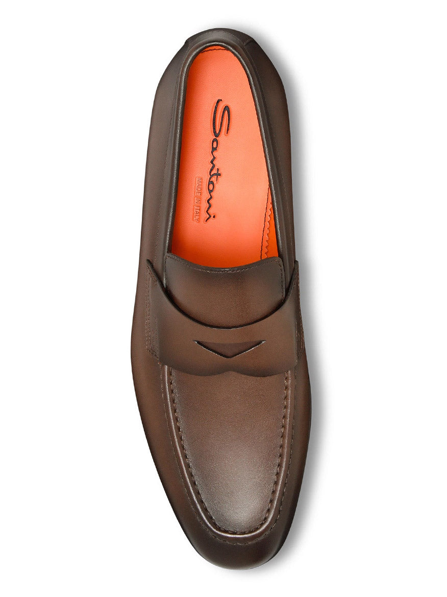 The Santoni Edvin Leather Loafer in brown leather highlights a rich brown finish with an orange insole, displaying the "Santoni" logo from above.