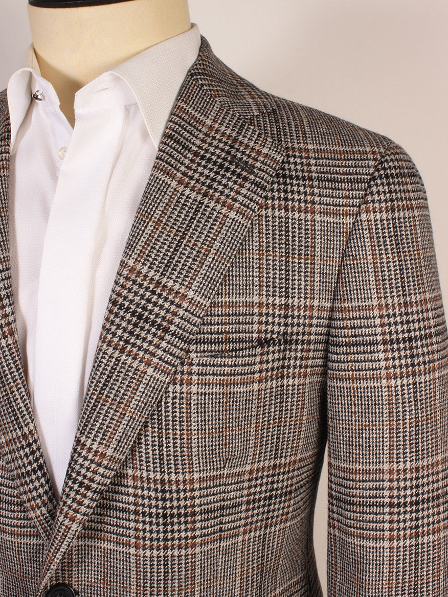 Close-up of a person wearing a white dress shirt and the Scabal Soho Glenn Plaid Sport Jacket in Black/Brown, featuring a notched lapel.
