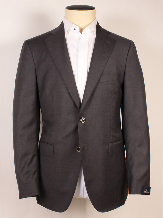 The Scabal Soho Wool Suit in Charcoal is a refined 2-button suit, expertly made in Portugal, featuring a wool jacket with notch lapels and two buttons, displayed over a white dress shirt on a mannequin against a plain background.