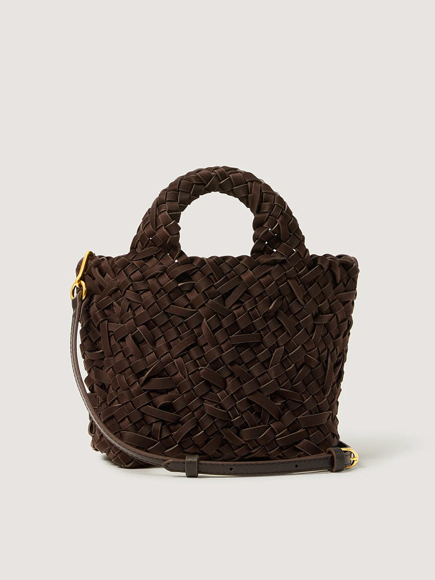 Naghedi St. Barths Petit Tote Nest Weave in Chocolate: a small dark brown handwoven neoprene tote with two top handles and an adjustable shoulder strap with gold-toned hardware.