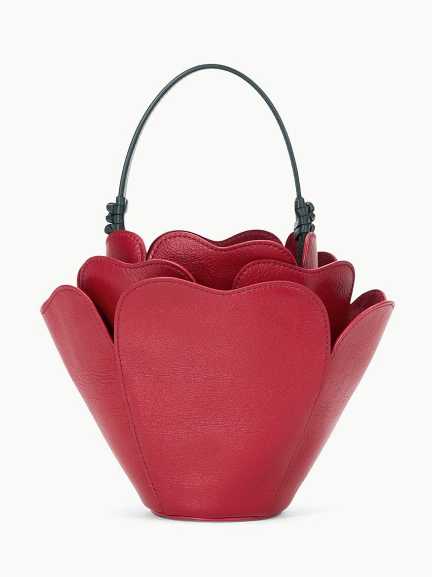 The STAUD Juliet Bag in Rouge, with its exquisite rose-shaped design and black handle, is the perfect novelty accessory to add a touch of elegance to any ensemble.