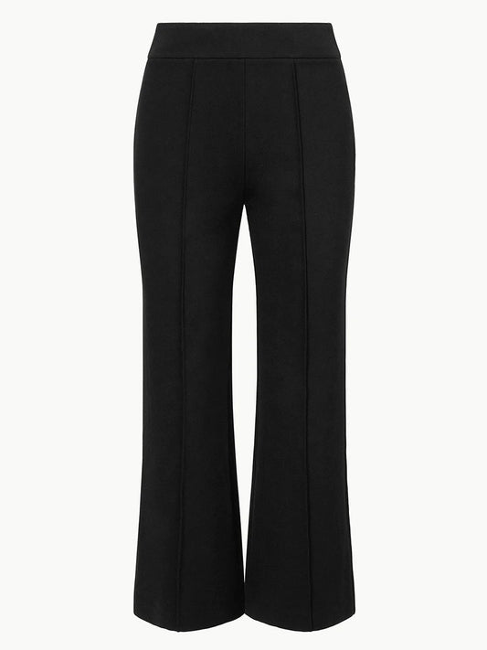 The STAUD Knack Pant in Black features a mid-rise, wide-leg silhouette in ponte knit fabric with front seam details and ankle-length cut, shown against a plain white background.