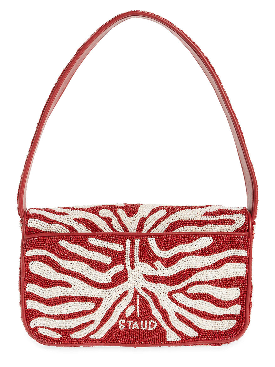 The STAUD Tommy Beaded Bag in Scarlet/White Zebra features red and white hand-beaded abstract and zebra patterns with the brand name "STAUD" on the front flap.