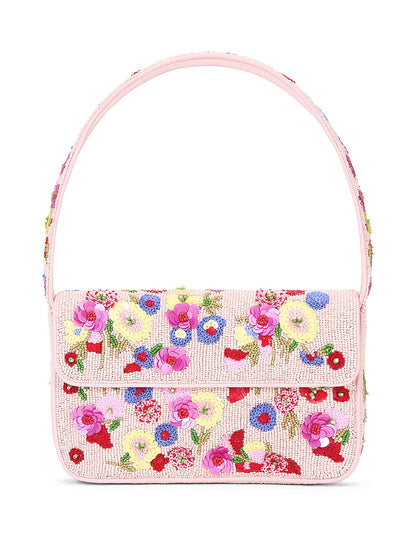 The STAUD Tommy Beaded Bag in Wildflowers is a beautifully crafted handbag made from vegan leather, featuring intricate pink floral embroidery with colorful 3D flower patterns on the front and a graceful curved handle.