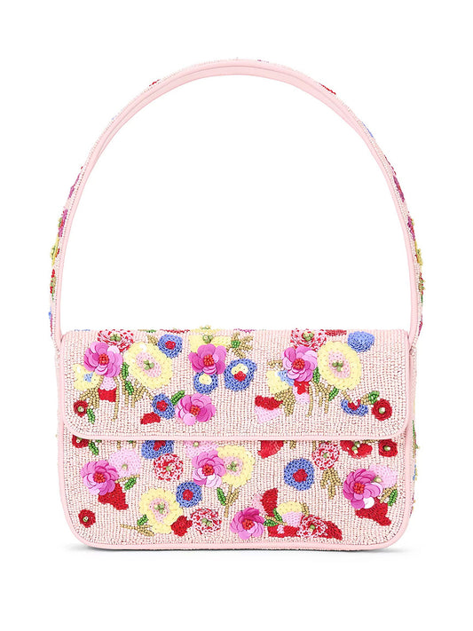 The STAUD Tommy Beaded Bag in Wildflowers is a beautifully crafted handbag made from vegan leather, featuring intricate pink floral embroidery with colorful 3D flower patterns on the front and a graceful curved handle.