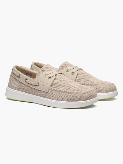 The Swims Breeze Boat Shoe in Mist/Sand features beige mesh uppers for lightweight comfort, white soles, lace-up design, and side eyelet details, shown on a plain white background.