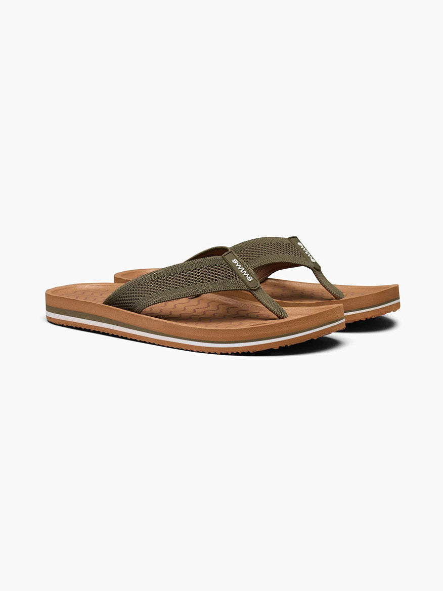 A pair of green Swims Napoli flip-flops with a cork footbed and arch support.