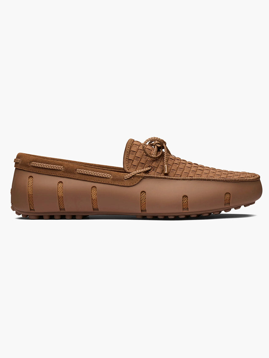 The Swims Woven Driver in Nut features a water-friendly design with a textured pebble sole and drainage slits, displayed in a side profile against a white background.