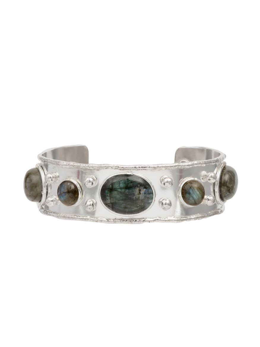 Sylvia Toledano Cuff Byzantine in Labradorite & Silver is a textured band bracelet adorned with oval and round labradorite stones, elegantly gilded in brass and silver.