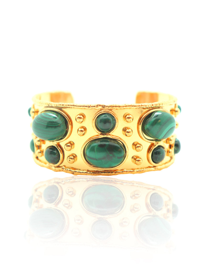 The Sylvia Toledano Cuff Byzantine in Malachite showcases an exquisite fine gold design with green oval malachite stones and delicate gold accents, gleaming beautifully under bright light.