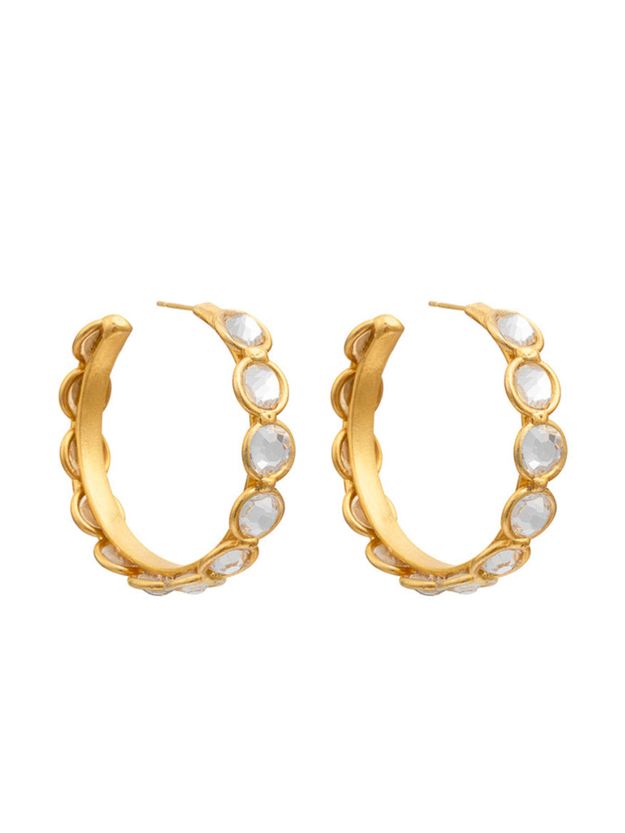 A pair of Sylvia Toledano Earrings Candies in Gold & Swarovski Crystals, adorned with circular white gemstones and featuring sparkling Swarovski Elements, create an exquisite statement.