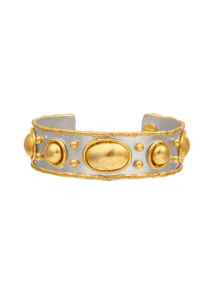 The Sylvia Toledano Cuff Byzantine in Gold and Silver showcases a sophisticated silver design accented with striking large oval and circular gold details, offering a classic and elegant appearance.