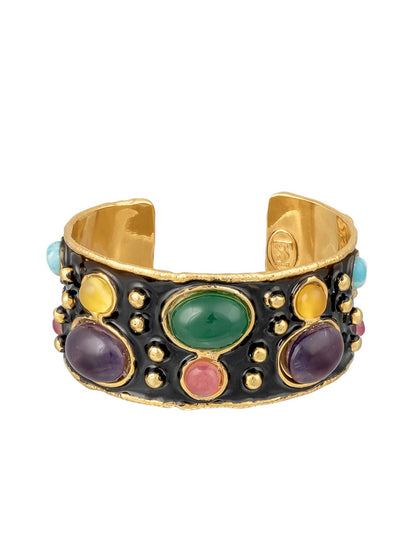 Introducing the Sylvia Toledano Cuff Byzantine in Multi Winter & Black Enamel, a stunning gold bracelet adorned with multicolored gemstones—green onyx, purple, yellow, blue, and pink—beautifully set in a black band with textured edges.