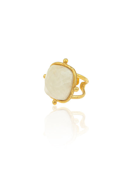 Sylvia Toledano Ring Cushion in Moonstone, crafted in fine gold with a large square moonstone and an innovative band design, set against a white background.