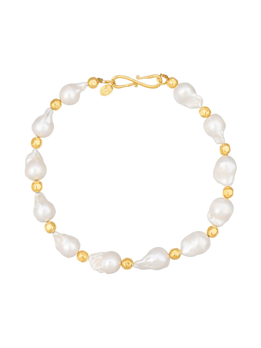 A Sylvia Toledano Necklace Grace in Gold & Baroque Pearls featuring Baroque Pearls separated by small gold beads and secured with a brass gilded clasp.