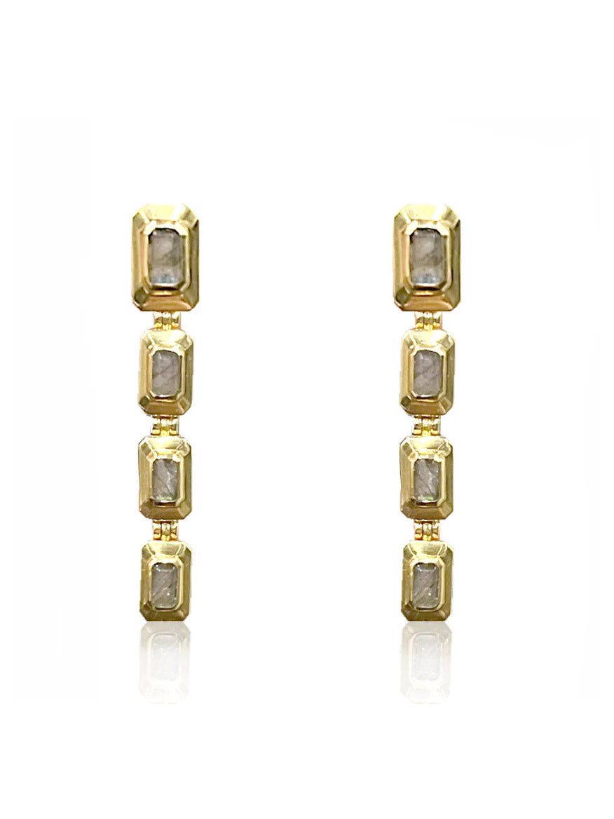 Tat2 Designs Labradorite Beryl Earrings in Gold feature four vertically aligned rectangular clear gemstones set in gold frames, blending vintage and modern styles, shown on a white background.