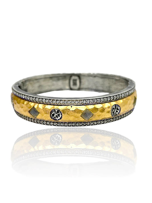 The Tat2 Designs Labradorite Mota Coin Bangle in Vintage Silver & Gold features an adjustable design with a hammered gold center, silver edges, and alternating diamond and round accents for added elegance and comfort.