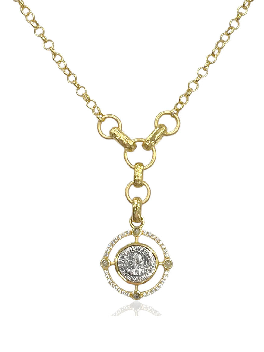 The Tat2 Designs Miko Coin Necklace in Gold & Vintage Silver features a circular pendant with gold detailing and a mix of finishes, offering an elegant touch to any look.