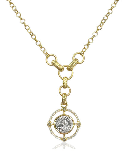 The Tat2 Designs Miko Coin Necklace in Gold & Vintage Silver features a circular pendant with gold detailing and a mix of finishes, offering an elegant touch to any look.