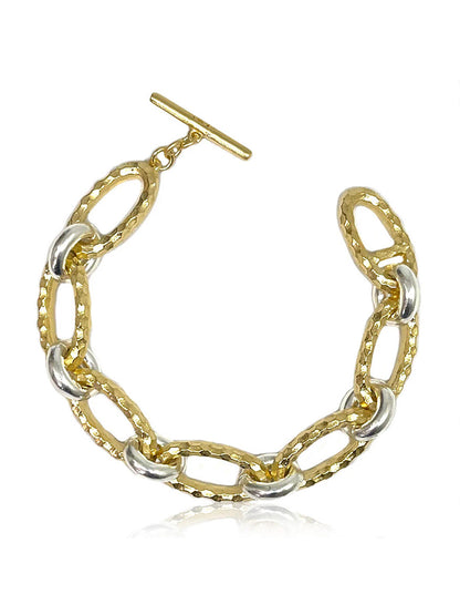 The Tat2 Designs Ravelle Hammered Chain Bracelet in Gold Two-Tone features gold and silver chain links with custom metal textures, modern shapes, and a T-bar clasp from the Prince Collection.