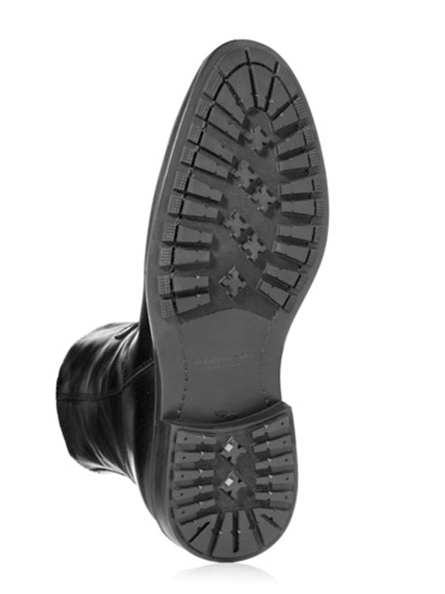 The sole of the To Boot New York Emerson Boot in Black is shown with a textured tread pattern and cross-shaped grips, viewed from the bottom against a white background. Expertly handcrafted in Italy, this premium design ensures both style and durability.