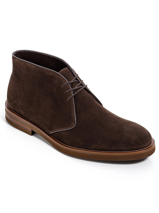 The To Boot New York Monaco Desert Boot in Dark Brown Suede features thin laces and a tan rubber sole, displayed at a slight angle on a white background.