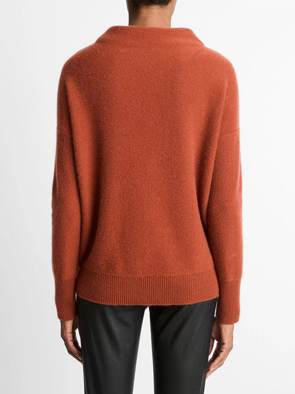 Person shown from the back against a plain white background, wearing a loose-fitting Vince Plush Cashmere Funnel-Neck Sweater in Tuscan Red and black pants.